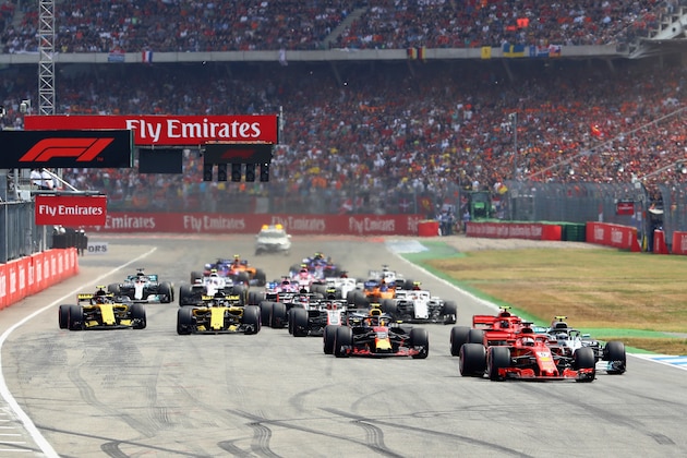 HOCKENHEIM, GERMANY - JULY 22: Sebastian Vettel of Germany driving the (5) Scuderia Ferrari SF71H leads the field towards the first corner during the Formula One Grand Prix of Germany at Hockenheimring on July 22, 2018 in Hockenheim, Germany.  (Photo by Mark Thompson/Getty Images)