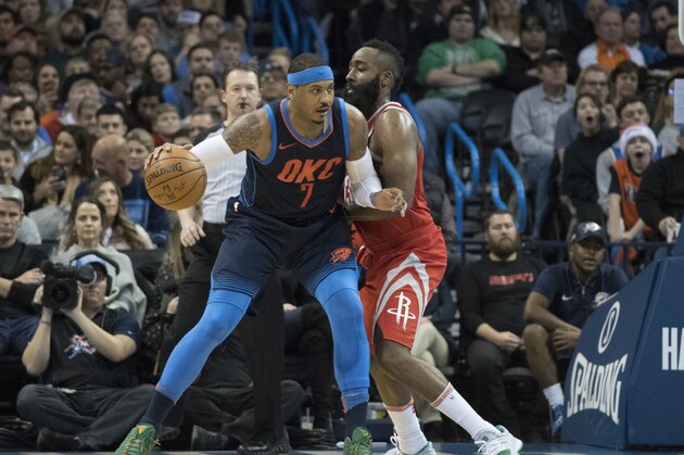 OKLAHOMA CITY, OK - DECEMBER 25: James Harden #13 of the Houston Rockets blocks Carmelo Anthony #7 of the Oklahoma City Thunder during the second half of a NBA  game at the Chesapeake Energy Arena on December 25, 2017 in Oklahoma City, Oklahoma. The Thunder defeated the Rockets 112-107. NOTE TO USER: User expressly acknowledges and agrees that, by downloading and or using this photograph, User is consenting to the terms and conditions of the Getty Images License Agreement. (Photo by J Pat Carter/Getty Images)