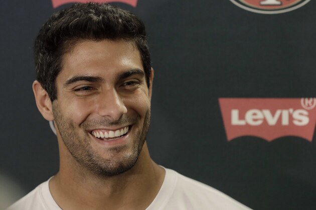 San Francisco 49ers quarterback Jimmy Garoppolo speaks to reporters before NFL football practice at the team's headquarters in Santa Clara, Calif., Wednesday, June 13, 2018. Year one under coach Kyle Shanahan was a bit of a whirlwind for the San Francisco 49ers with new systems to install and a midseason quarterback change to Jimmy Garoppolo. It's far different this year as the Niners wrap up the offseason program. (AP Photo/Jeff Chiu)