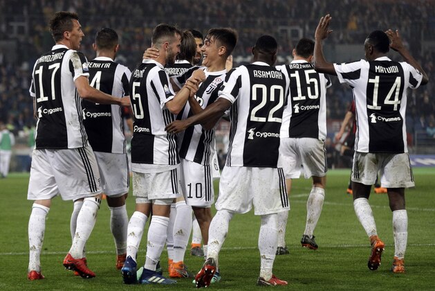 Juventus players celebrate their side's 4th goal, during the Italian Cup final soccer match between Juventus and AC Milan, at the Rome Olympic stadium, Wednesday, May 9, 2018. (AP Photo/Gregorio Borgia)