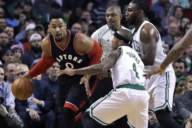 Toronto Raptors center Jared Sullinger (0) is trailed by Boston Celtics guard Isaiah Thomas (4) and forward Jae Crowder during the first quarter of an NBA basketball game in Boston, Wednesday, Feb. 1, 2017. (AP Photo/Charles Krupa)