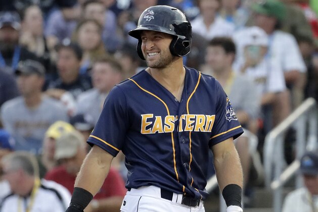 Eastern Division's Tim Tebow smiles toward Western Division pitcher Beau Burrows during the second inning of the Eastern League All-Star Double-A baseball game, Wednesday, July 11, 2018, in Trenton, N.J. (AP Photo/Julio Cortez)