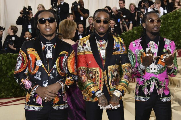 Takeoff, of Migos, from left, Offset and Quavo attend The Metropolitan Museum of Art's Costume Institute benefit gala celebrating the opening of the Heavenly Bodies: Fashion and the Catholic Imagination exhibition on Monday, May 7, 2018, in New York. (Photo by Charles Sykes/Invision/AP)