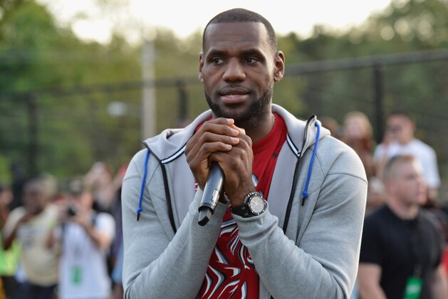 AKRON, OH - SEPTEMBER 25: LeBron James joined Sprite to reveal two refurbished outdoor basketball courts with painted artwork by Futura at Patterson Park on September 25, 2014 in Akron, Ohio.  (Photo by Duane Prokop/Getty Images for Sprite)