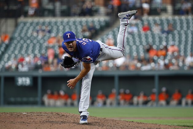 Texas Rangers starting pitcher Cole Hamels throws to the Baltimore Orioles during a baseball game, Friday, July 13, 2018, in Baltimore. (AP Photo/Patrick Semansky)