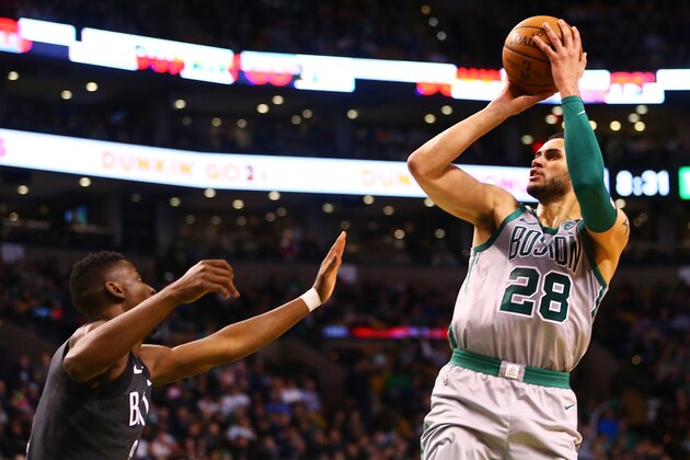 BOSTON, MA - APRIL 11:  Abdel Nader #28 of the Boston Celtics shoots the ball over Caris LeVert #22 of the Brooklyn Nets during a game at TD Garden on April 11, 2018 in Boston, Massachusetts. NOTE TO USER: User expressly acknowledges and agrees that, by downloading and or using this photograph, User is consenting to the terms and conditions of the Getty Images License Agreement. (Photo by Adam Glanzman/Getty Images)