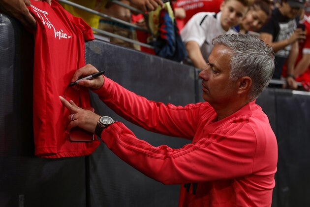 GLENDALE, AZ - JULY 19:  Manchester United manager Jose Mourinho signs an autograph prior to the International Champions Cup game against Club America at the University of Phoenix Stadium on July 19, 2018 in Glendale, Arizona.  (Photo by Christian Petersen/Getty Images for International Champions Cup)