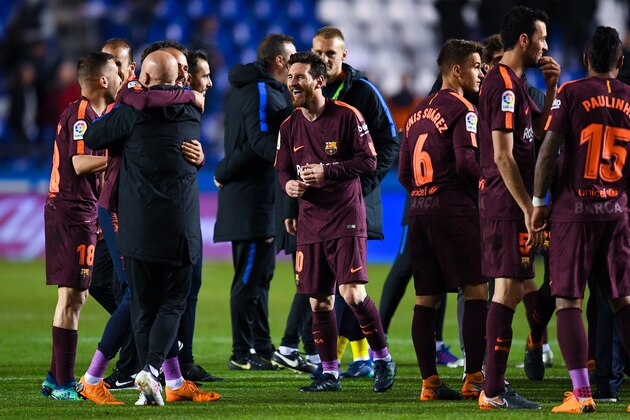 LA CORUNA, SPAIN - APRIL 29:  Lionel Messi of FC Barcelona celebrates with his team mates winning La Liga title after the La Liga match between Deportivo La Coruna and Barcelona at Estadio Riazor on April 29, 2018 in La Coruna, Spain .  (Photo by David Ramos/Getty Images)