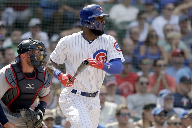Chicago Cubs' Jason Heyward watches his RBI single off Minnesota Twins relief pitcher Zach Duke during the fifth inning of a baseball game Saturday, June 30, 2018, in Chicago. Ian Happ scored. (AP Photo/Charles Rex Arbogast)