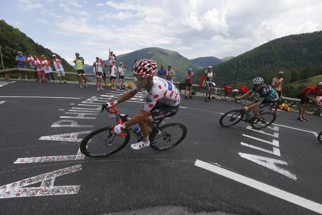 France's Julian Alaphilippe, center, and Austria's Gregor Muehlberger climb Portet d'Aspet pass during the sixteenth stage of the Tour de France cycling race over 218 kilometers (135.5 miles) with start in Carcassonne and finish in Bagneres-de-Luchon, France, , Tuesday, July 24, 2018. (AP Photo/Peter Dejong)