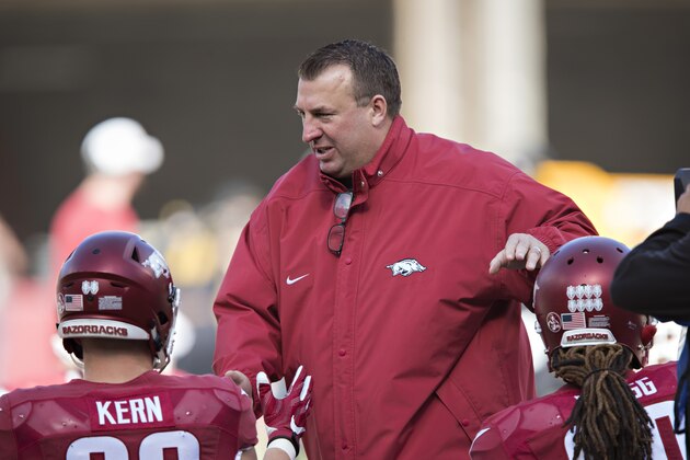 FAYETTEVILLE, AR - NOVEMBER 24:  Head Coach Bret Bielema of the Arkansas Razorbacks greets players before a game against the Missouri Tigers at Razorback Stadium on November 24, 2017 in Fayetteville, Arkansas.  The Tigers defeated the Razorbacks 48-45.  (Photo by Wesley Hitt/Getty Images)