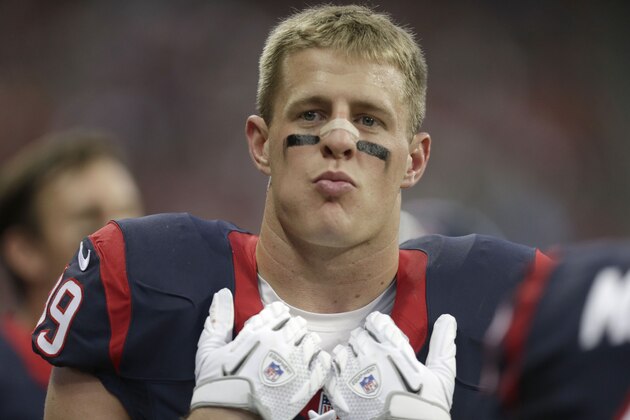 Houston Texans defensive end J.J. Watt stands on the sidelines during the first half of a preseason NFL football game against the Miami Dolphins Saturday, Aug. 17, 2013, in Houston. (AP Photo/Patric Schneider)