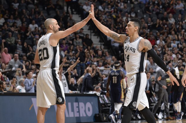 SAN ANTONIO, TX - FEBRUARY 28:  Manu Ginobili #20 and Danny Green #14 of the San Antonio Spurs give high fives during the game against the New Orleans Pelicans on February 28, 2018 at the AT&T Center in San Antonio, Texas. NOTE TO USER: User expressly acknowledges and agrees that, by downloading and or using this photograph, user is consenting to the terms and conditions of the Getty Images License Agreement. Mandatory Copyright Notice: Copyright 2018 NBAE (Photos by Mark Sobhani/NBAE via Getty Images)