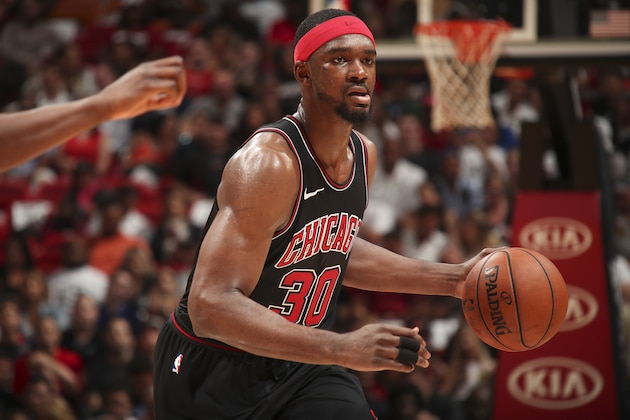 MIAMI, FL - MARCH 29: Noah Vonleh #30 of the Chicago Bulls dribbles the ball during the game against the Miami Heat on March 29, 2018 at American Airlines Arena in Miami, Florida. NOTE TO USER: User expressly acknowledges and agrees that, by downloading and or using this Photograph, user is consenting to the terms and conditions of the Getty Images License Agreement. Mandatory Copyright Notice: Copyright 2018 NBAE (Photo by Issac Baldizon/NBAE via Getty Images)