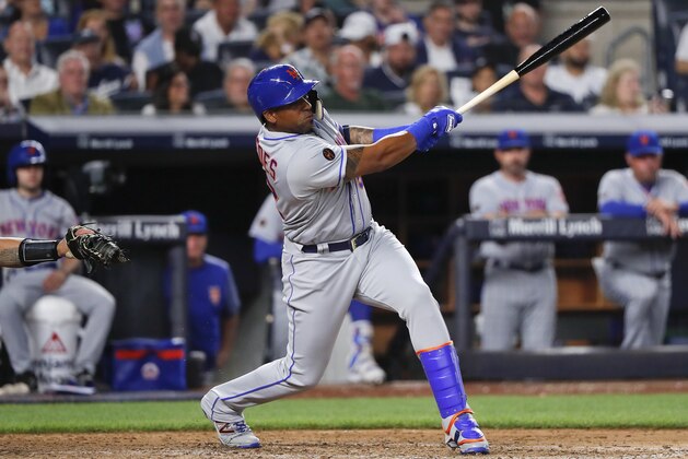 New York Mets' Yoenis Cespedes connects for a base hit against the New York Yankees during the sixth inning of a baseball game, Friday, July 20, 2018, in New York. (AP Photo/Julie Jacobson)