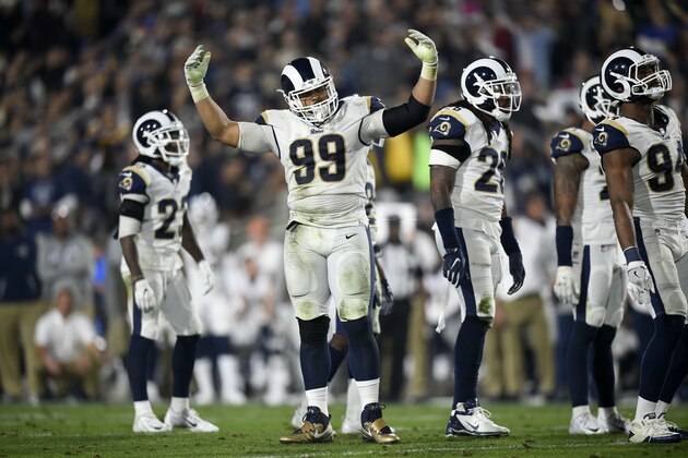 Los Angeles Rams defensive tackle Aaron Donald (99) cheers on the crowd during the first half of an NFL football wild-card playoff game against the Atlanta Falcons Saturday, Jan. 6, 2018, in Los Angeles. (AP Photo/Kelvin Kuo)