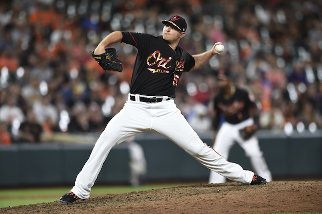 Baltimore Orioles' Zach Britton throws against the Texas Rangers in the ninth inning of a baseball game, Saturday, July 14, 2018, in Baltimore. (AP Photo/Gail Burton)
