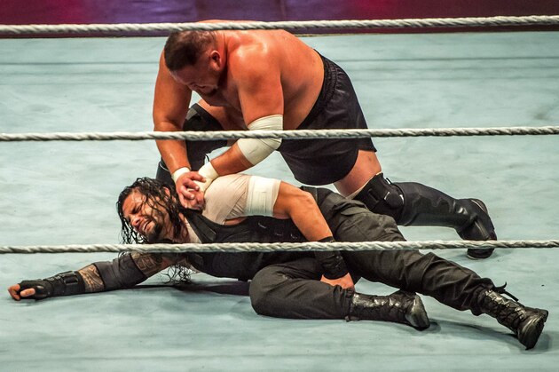 Roman and Samoa Joe (R) battle during the WWE show at Zenith Arena on may 09, 2017 in Lille, France. / AFP PHOTO / PHILIPPE HUGUEN        (Photo credit should read PHILIPPE HUGUEN/AFP/Getty Images)