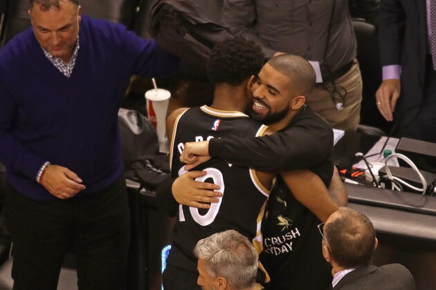 TORONTO,ON - NOVEMBER 16:  Toronto Raptors Ambassador and Performer Drake hugs DeMar DeRozan #10 of the Toronto Raptors after the game against the Golden State Warriors at Air Canada Centre on November 16, 2016 in Toronto, Ontario, Canada. NOTE TO USER: User expressly acknowledges and agrees that, by downloading and/or using this photograph, user is consenting to the terms and conditions of the Getty Images License Agreement. Mandatory Copyright Notice: Copyright 2016 NBAE (Photo by Dave Sandford/NBAE via Getty Images)