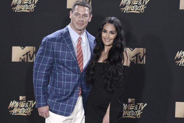 John Cena, left, and Nikki Bella pose in the press room at the MTV Movie and TV Awards at the Shrine Auditorium on Sunday, May 7, 2017, in Los Angeles. (Photo by Richard Shotwell/Invision/AP)