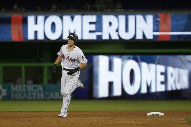 Miami Marlins' J.T. Realmuto rounds second base after he hit a home run during the fifth inning of a baseball game against the Tampa Bay Rays, Monday, July 2, 2018, in Miami. (AP Photo/Wilfredo Lee)