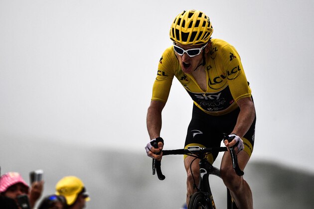 TOPSHOT - Great Britain's Geraint Thomas, wearing the overall leader's yellow jersey, crosses the finish line ta place third of the 17th stage of the 105th edition of the Tour de France cycling race, between Bagneres-de-Luchon and Saint-Lary-Soulan Col du Portet, southwestern France, on July 25, 2018. (Photo by Jeff PACHOUD / AFP)        (Photo credit should read JEFF PACHOUD/AFP/Getty Images)