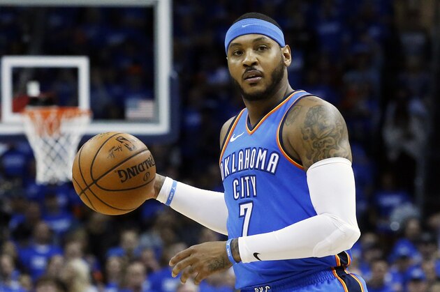 FILE - This is an April 25, 2018, file photo showing Oklahoma City Thunder forward Carmelo Anthony (7) during Game 5 of an NBA basketball first-round playoff series against the Utah Jazz, in Oklahoma City. Carmelo Anthony is done in Oklahoma City. A person with knowledge of the details tells The Associated Press the Thunder are sending the veteran NBA forward and a 2022 protected first-round pick to Atlanta in exchange for Hawks guard Dennis Schroder and Mike Muscala. (AP Photo/Sue Ogrocki, File)