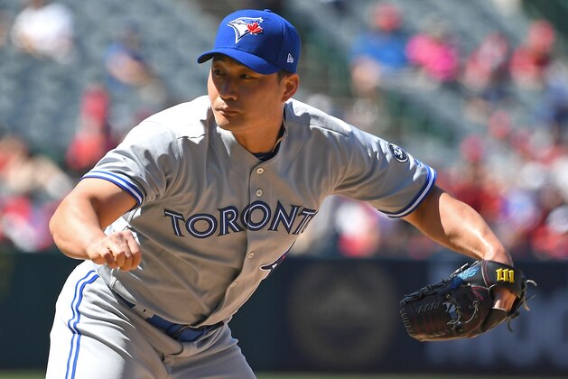 ANAHEIM, CA - JUNE 24:  Oh Seung-hwan #22 of the Toronto Blue Jays pitches in the game against the Los Angeles Angels of Anaheim at Angel Stadium on June 24, 2018 in Anaheim, California.  (Photo by Jayne Kamin-Oncea/Getty Images)