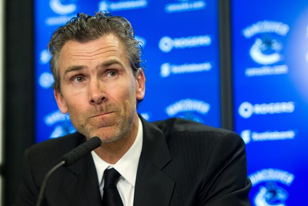 VANCOUVER, BC - MARCH 9: Trevor Linden listens to a question from the media during a press conference announcing him as the new President Hockey Operations of the Vancouver Canucks, April 09, 2014 at Rogers Arena in Vancouver, British Columbia, Canada.  (Photo by Rich Lam/Getty Images)