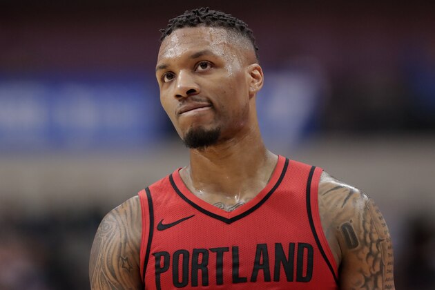Portland Trail Blazers guard Damian Lillard walks up court in the second half of an NBA basketball game against the Dallas Mavericks in Dallas, Tuesday, April 3, 2018. Lillard lead all scoring with 29 points in the 115-109 loss to the Mavericks. (AP Photo/Tony Gutierrez)