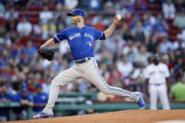 Toronto Blue Jays' J.A. Happ pitches during the first inning of a baseball game against the Boston Red Sox in Boston, Thursday, July 12, 2018. (AP Photo/Michael Dwyer)