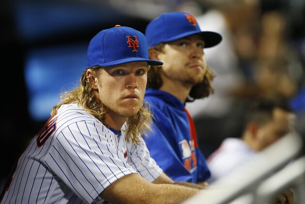 NEW YORK, NY - JULY 26: Noah Syndergaard #34 and Jacob deGrom #48 of the New York Mets look on against the St. Louis Cardinals in game two of a doubleheader at Citi Field on July 26, 2016 in the Flushing neighborhood of the Queens borough of New York City. (Photo by Rich Schultz/Getty Images)