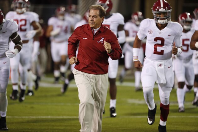 Alabama head coach Nick Saban leads his team to the field for pre-game warmups prior to an NCAA college football game against Mississippi State in Starkville, Miss., Saturday, Nov. 11, 2017. Alabama won 31-24. (AP Photo/Rogelio V. Solis)
