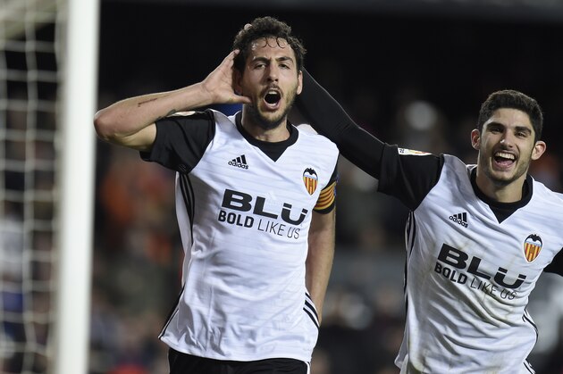 Valencia's midfielder Dani Parejo (L) celebrates with Valencia's Portuguese midfielder Manuel Guedes after scoring during the Spanish league football match between Valencia CF and Levante UD at the Mestalla stadium in Valencia on February 11, 2018. / AFP PHOTO / JOSE JORDAN        (Photo credit should read JOSE JORDAN/AFP/Getty Images)