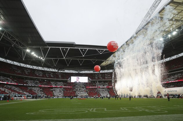 Pyrotechnics are ignited before an NFL football game between the Miami Dolphins and the New Orleans Saints at Wembley Stadium in London, Sunday Oct. 1, 2017. (AP Photo/Tim Ireland)