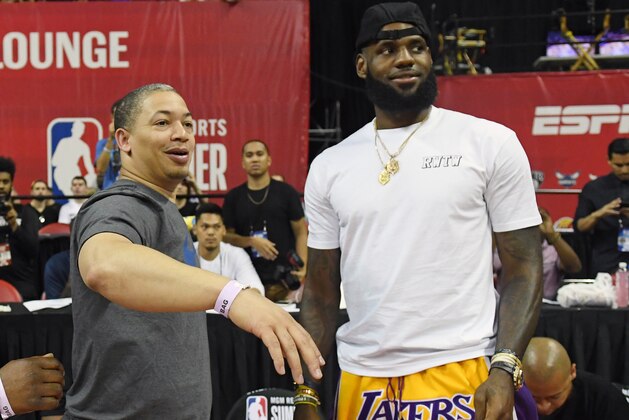 LAS VEGAS, NV - JULY 15:  Head coach Tyronn Lue (L) of the Cleveland Cavaliers talks with LeBron James of the Los Angeles Lakers after a quarterfinal game of the 2018 NBA Summer League between the Lakers and the Detroit Pistons at the Thomas & Mack Center on July 15, 2018 in Las Vegas, Nevada. NOTE TO USER: User expressly acknowledges and agrees that, by downloading and or using this photograph, User is consenting to the terms and conditions of the Getty Images License Agreement.  (Photo by Ethan Miller/Getty Images)