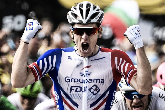 France's Arnaud Demare celebrates as he crosses the finish line to win the 18th stage of the 105th edition of the Tour de France cycling race, on July 26, 2018 between Trie-sur-Baise and Pau, southwestern France. (Photo by Philippe LOPEZ / AFP) / ALTERNATIVE CROP        (Photo credit should read PHILIPPE LOPEZ/AFP/Getty Images)