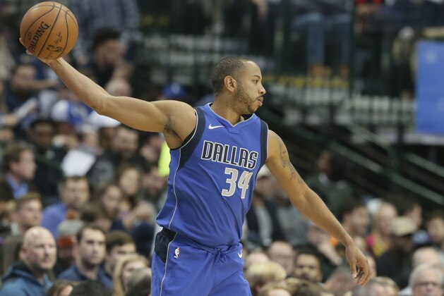 Dallas Mavericks guard Devin Harris (34) reaches with the ball during the first half of an NBA basketball game against the Philadelphia 76ers in Dallas, Saturday, Oct. 28, 2017. (AP Photo/LM Otero)