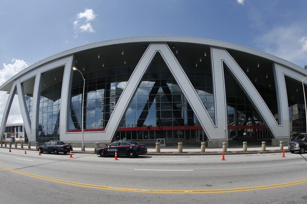 This image taken with a fisheye lense shows The Philips Arena, home of the Atlanta Hawks NBA basketball team, Thursday, July 6, 2017, in Atlanta. A former security manager at the arena says white entertainers performing there were allowed to bypass security measures while similar requests by black entertainers were denied. Alleging racial discrimination, Samuel R. Hayes III filed a federal lawsuit on Monday against Atlanta Hawks LLC, which operates the arena. The lawsuit says Hayes was fired because he's black and because he complained about security measures that he says were selectively enforced based on race. (AP Photo/John Bazemore) This image taken with a fisheye lense shows The Philips Arena, home of the Atlanta Hawks NBA basketball team, Thursday, July 6, 2017, in Atlanta. A former security manager at the arena says white entertainers performing there were allowed to bypass security measures while similar requests by black entertainers were denied. Alleging racial discrimination, Samuel R. Hayes III filed a federal lawsuit on Monday against Atlanta Hawks LLC, which operates the arena. The lawsuit says Hayes was fired because he's black and because he complained about security measures that he says were selectively enforced based on race. (AP Photo/John Bazemore)