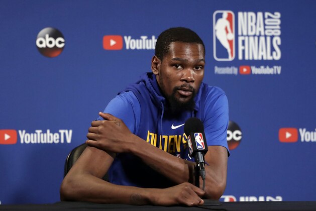 Golden State Warriors' Kevin Durant answers questions after an NBA basketball practice, Wednesday, May 30, 2018, in Oakland, Calif. The Warriors face the Cleveland Cavaliers in Game 1 of the NBA Finals on Thursday in Oakland. (AP Photo/Marcio Jose Sanchez)