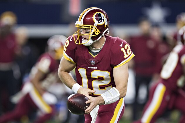 ARLINGTON, TX - NOVEMBER 30:  Colt McCoy #12 of the Washington Redskins drops back to make a hand off during a game against the Dallas Cowboys at AT&T Stadium on November 30, 2017 in Arlington, Texas.  The Cowboys defeated the Redskins 38-14.  (Photo by Wesley Hitt/Getty Images)