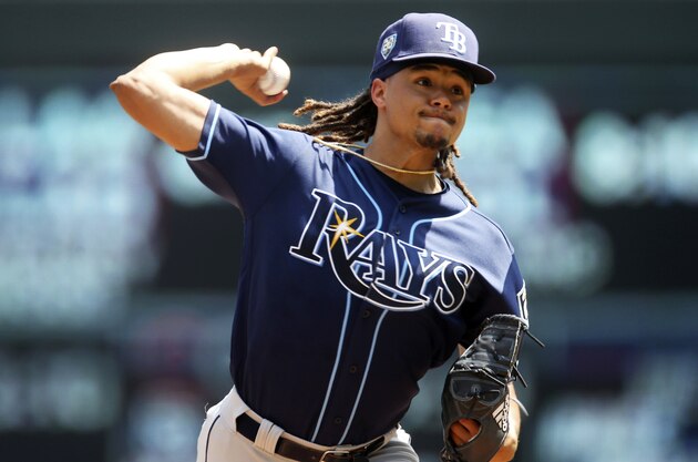 Tampa Bay Rays pitcher Chris Archer throws against the Minnesota Twins in the first inning of a baseball game Saturday, July 14, 2018, in Minneapolis. (AP Photo/Jim Mone)