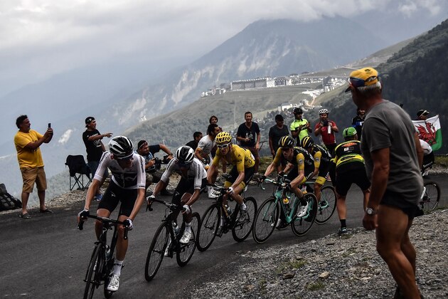 (From L) Netherlands' Wout Poels, Colombia's Egan Bernal, Great Britain's Geraint Thomas, wearing the overall leader's yellow jersey, Netherlands' Steven Kruijswijk and Slovenia's Primoz Roglic ride uphill during the 17th stage of the 105th edition of the Tour de France cycling race, between Bagneres-de-Luchon and Saint-Lary-Soulan Col du Portet, southwestern France, on July 25, 2018. (Photo by Marco BERTORELLO / AFP)        (Photo credit should read MARCO BERTORELLO/AFP/Getty Images)