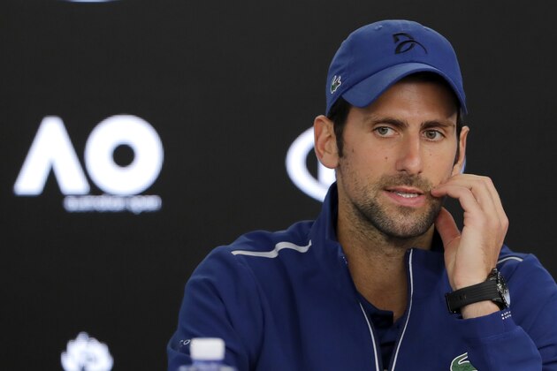 Serbia's Novak Djokovic gestures during a press conference at the Australian Open tennis championships in Melbourne, Australia, Saturday, Jan. 13, 2018. (AP Photo/Vincent Thian)