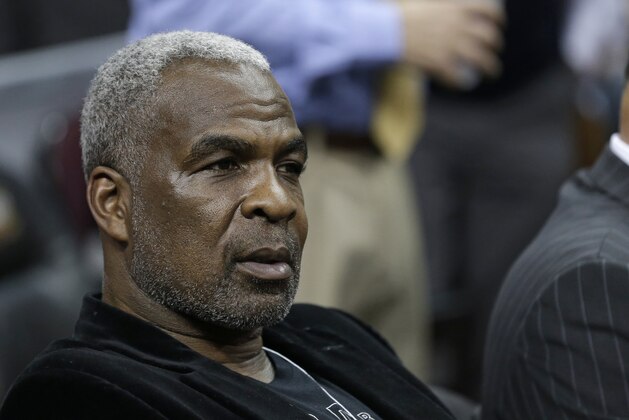 FILE - In this Feb. 23, 2017 file photo, former New York Knicks player Charles Oakley waits for an NBA basketball game to begin between the New York Knicks and the Cleveland Cavaliers, in Cleveland. Oakley is set for his day in court Tuesday, April 11, 2017, in the wake of his arrest at a Knicks game at Madison Square Garden in February. Oakley was charged with three counts of misdemeanor assault and one count of criminal trespass. (AP Photo/Tony Dejak, File)