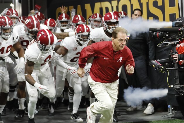 FILE - In this Jan. 8, 2018, file photo, Alabama coach Nick Saban leads his team onto the field before the NCAA college football playoff championship game against Georgia in Atlanta.  Saban should feel right at home at the College Football Hall of Fame, the facility hosting part of this week's SEC media days. The Hall of Fame in downtown Atlanta is only a short walk from Mercedes-Benz Stadium, where six months ago Saban’s Alabama team beat Georgia for his sixth national championship. (AP Photo/David Goldman, File)