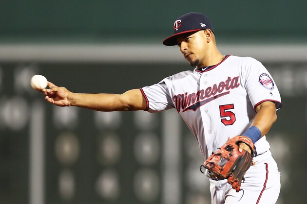 BOSTON, MA - JULY 26:  Eduardo Escobar #5 of the Minnesota Twins throws to first base during a game against the Boston Red Sox at Fenway Park on July 26, 2018 in Boston, Massachusetts.  (Photo by Adam Glanzman/Getty Images)