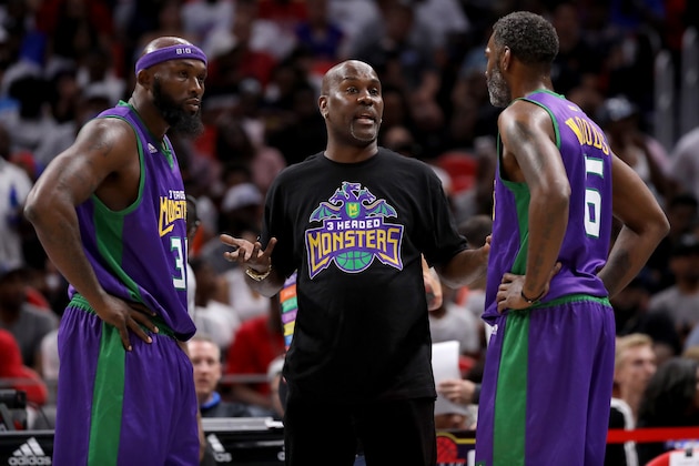 DETROIT, MI - JULY 13: Head coach Gary Payton of the 3 Headed Monsters meets with Reggie Evans #30 and Qyntel Woods #6 during the game against Tri-State during BIG3 - Week Four at Little Caesars Arena on July 13, 2018 in Detroit, Michigan. (Photo by Gregory Shamus/BIG3/Getty Images) DETROIT, MI - JULY 13: Head coach Gary Payton of the 3 Headed Monsters meets with Reggie Evans #30 and Qyntel Woods #6 during the game against Tri-State during BIG3 - Week Four at Little Caesars Arena on July 13, 2018 in Detroit, Michigan. (Photo by Gregory Shamus/BIG3/Getty Images)