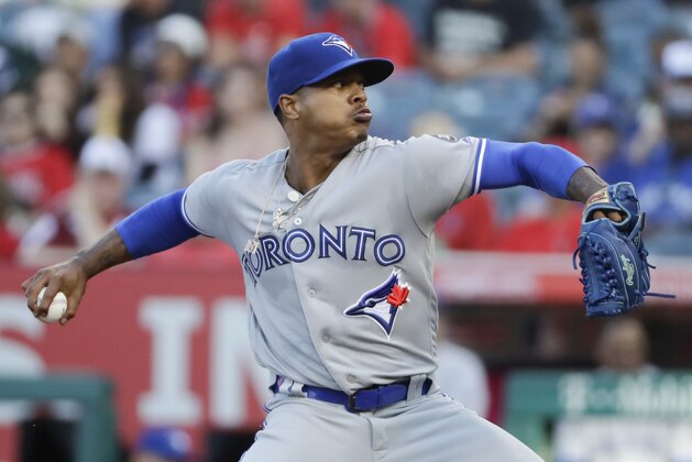 Toronto Blue Jays starting pitcher Marcus Stroman throws to a Los Angeles Angels batter during the first inning of a baseball game in Anaheim, Calif., Saturday, June 23, 2018. (AP Photo/Chris Carlson)