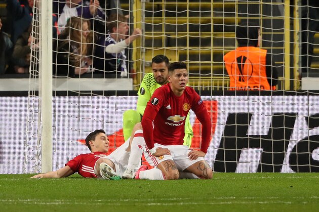 BRUSSELS, BELGIUM - APRIL 13: A dejected looking Marcos Rojo, Matteo Darmian and Manchester United goalkeeper, Sergio Romero during the UEFA Europa League quarter final first leg match between RSC Anderlecht and Manchester United at Constant Vanden Stock Stadium on April 13, 2017 in Brussels, Belgium. (Photo by Matthew Ashton - AMA/Getty Images)